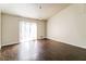 Bright living room featuring hardwood floors and sliding glass doors at 205 Ridge Run, Stockbridge, GA 30281