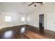 Living room with hardwood floors, vaulted ceiling, and an accent wall at 205 Ridge Run, Stockbridge, GA 30281