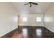 Bright living room featuring hardwood floors, vaulted ceilings, and an accent wall at 205 Ridge Run, Stockbridge, GA 30281