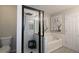 Bathroom featuring double vanity, soaking tub, tiled walk-in shower, and neutral walls at 2353 Maplewood Se Ct # 25, Atlanta, GA 30339