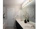 Double vanity bathroom with large mirror and updated finishes at 2353 Maplewood Se Ct # 25, Atlanta, GA 30339