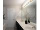 Bathroom featuring double vanity, soaking tub, and modern fixtures with neutral walls at 2353 Maplewood Se Ct # 25, Atlanta, GA 30339