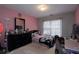 Pink bedroom with a double bed and dresser at 2353 Maplewood Se Ct # 25, Atlanta, GA 30339