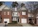 Brick townhouse with attached garage and landscaping at 2353 Maplewood Se Ct # 25, Atlanta, GA 30339