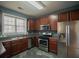 Kitchen with dark wood cabinets and stainless steel appliances at 2353 Maplewood Se Ct # 25, Atlanta, GA 30339