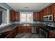 Kitchen with dark wood cabinets and stainless steel appliances at 2353 Maplewood Se Ct # 25, Atlanta, GA 30339