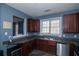 Kitchen with dark wood cabinets and stainless steel appliances at 2353 Maplewood Se Ct # 25, Atlanta, GA 30339