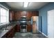 Efficient kitchen featuring stainless steel appliances and ample counter space, illuminated by a bright window at 2353 Maplewood Se Ct # 25, Atlanta, GA 30339
