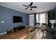 Living room with hardwood floors and large TV at 2353 Maplewood Se Ct # 25, Atlanta, GA 30339