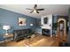 Cozy living room features a fireplace, ceiling fan, and stylish decor, creating a warm and inviting atmosphere at 2353 Maplewood Se Ct # 25, Atlanta, GA 30339