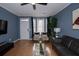 Bright and airy living room with a large window, comfortable seating, and a modern aesthetic at 2353 Maplewood Se Ct # 25, Atlanta, GA 30339