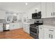 Renovated kitchen, featuring white shaker cabinets and stainless steel appliances at 3781 Hickory Ridge Ct, Marietta, GA 30066