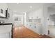 Modern kitchen with white cabinets, stainless steel appliances and wood flooring at 3781 Hickory Ridge Ct, Marietta, GA 30066