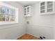 Laundry room with white cabinets and wood flooring at 3781 Hickory Ridge Ct, Marietta, GA 30066