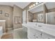 Main bathroom with a shower and a double vanity at 3945 Brushy Creek Way, Suwanee, GA 30024