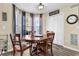 Dining area with wood table and chairs, bay window, and hardwood floors at 3945 Brushy Creek Way, Suwanee, GA 30024