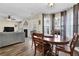 Dining area with wood table and chairs, bay window, and hardwood floors at 3945 Brushy Creek Way, Suwanee, GA 30024