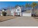 Two-story house with attached garage and driveway at 3945 Brushy Creek Way, Suwanee, GA 30024