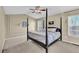 Large main bedroom with a post bed and neutral wall colors at 3945 Brushy Creek Way, Suwanee, GA 30024