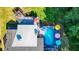 High-angle view of house, deck, and pool; lush green surroundings at 4692 Yeager Rd, Douglasville, GA 30135