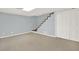 Finished basement with neutral carpeting and ample space at 4692 Yeager Rd, Douglasville, GA 30135