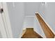 Basement stairs with wood trim and neutral wall colors at 4692 Yeager Rd, Douglasville, GA 30135