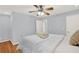 Serene bedroom with hardwood floors and a ceiling fan at 4692 Yeager Rd, Douglasville, GA 30135