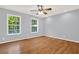 Well-lit bedroom with hardwood floors and two large windows at 4692 Yeager Rd, Douglasville, GA 30135