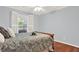 Comfortable bedroom with hardwood floors and plantation shutters at 4692 Yeager Rd, Douglasville, GA 30135