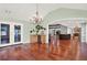 Spacious dining room featuring hardwood floors, chandelier, and access to backyard at 4692 Yeager Rd, Douglasville, GA 30135