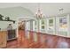 Bright dining room with hardwood floors, chandelier, and view into kitchen at 4692 Yeager Rd, Douglasville, GA 30135