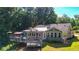 Gray house exterior with wrap around deck and pergola at 4692 Yeager Rd, Douglasville, GA 30135