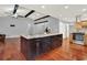 Kitchen island with dark cabinetry, granite countertops and hardwood floors at 4692 Yeager Rd, Douglasville, GA 30135