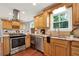 Kitchen with granite countertops, stainless steel appliances, and wood cabinets at 4692 Yeager Rd, Douglasville, GA 30135