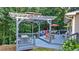 Peaceful pergola and deck area with firepit and seating at 4692 Yeager Rd, Douglasville, GA 30135