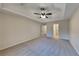 Spacious primary bedroom with ceiling fan and carpet at 550 Jodeco Station St, Stockbridge, GA 30281