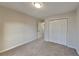 Well-lit bedroom featuring a double-door closet at 550 Jodeco Station St, Stockbridge, GA 30281