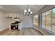 Kitchen dining area with chandelier and large windows at 550 Jodeco Station St, Stockbridge, GA 30281