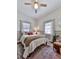 Bright bedroom with neutral decor and two windows at 731 E Main St, Canton, GA 30114