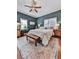 Relaxing bedroom with a ceiling fan and neutral bedding at 731 E Main St, Canton, GA 30114