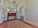 Bright hallway with hardwood floors and decorative wallpaper at 731 E Main St, Canton, GA 30114