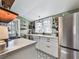 Bright kitchen with white cabinets, farmhouse sink, and star patterned floor at 731 E Main St, Canton, GA 30114