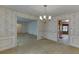 Dining room with chandelier and view of kitchen and living room at 5694 Cub Ct, Stone Mountain, GA 30087