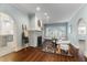 Living room features hardwood floors, fireplace, and view into kitchen at 648 Cooledge Ne Ave, Atlanta, GA 30306