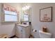 Elegant bathroom with granite countertop, updated vanity, and neutral color palette at 1103 Ridenour Ct, Kennesaw, GA 30152