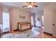 Charming bedroom with hardwood floors, pink curtains, and crib at 1103 Ridenour Ct, Kennesaw, GA 30152