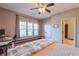 Comfortable bedroom with hardwood floors, large windows, and plenty of natural light at 1103 Ridenour Ct, Kennesaw, GA 30152