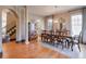 Elegant dining room with hardwood floors, chandelier, and large windows at 1103 Ridenour Ct, Kennesaw, GA 30152