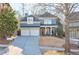 Stunning two-story home with a gray exterior, double garage, and manicured lawn at 1103 Ridenour Ct, Kennesaw, GA 30152