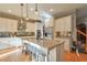 Modern kitchen with white cabinets, granite countertops, and stainless steel appliances at 1103 Ridenour Ct, Kennesaw, GA 30152